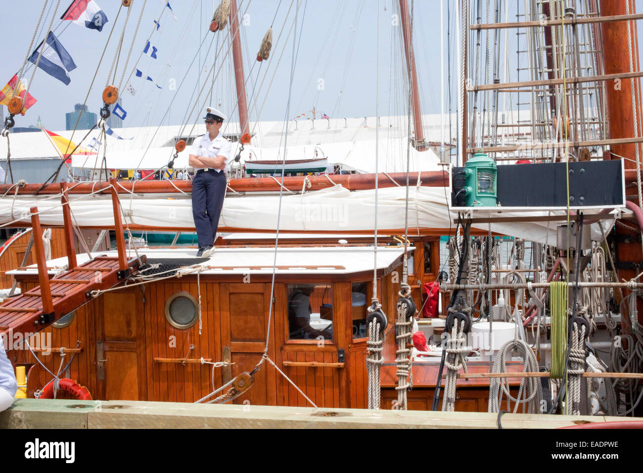 Sailor on wooden sailboat Stock Photo