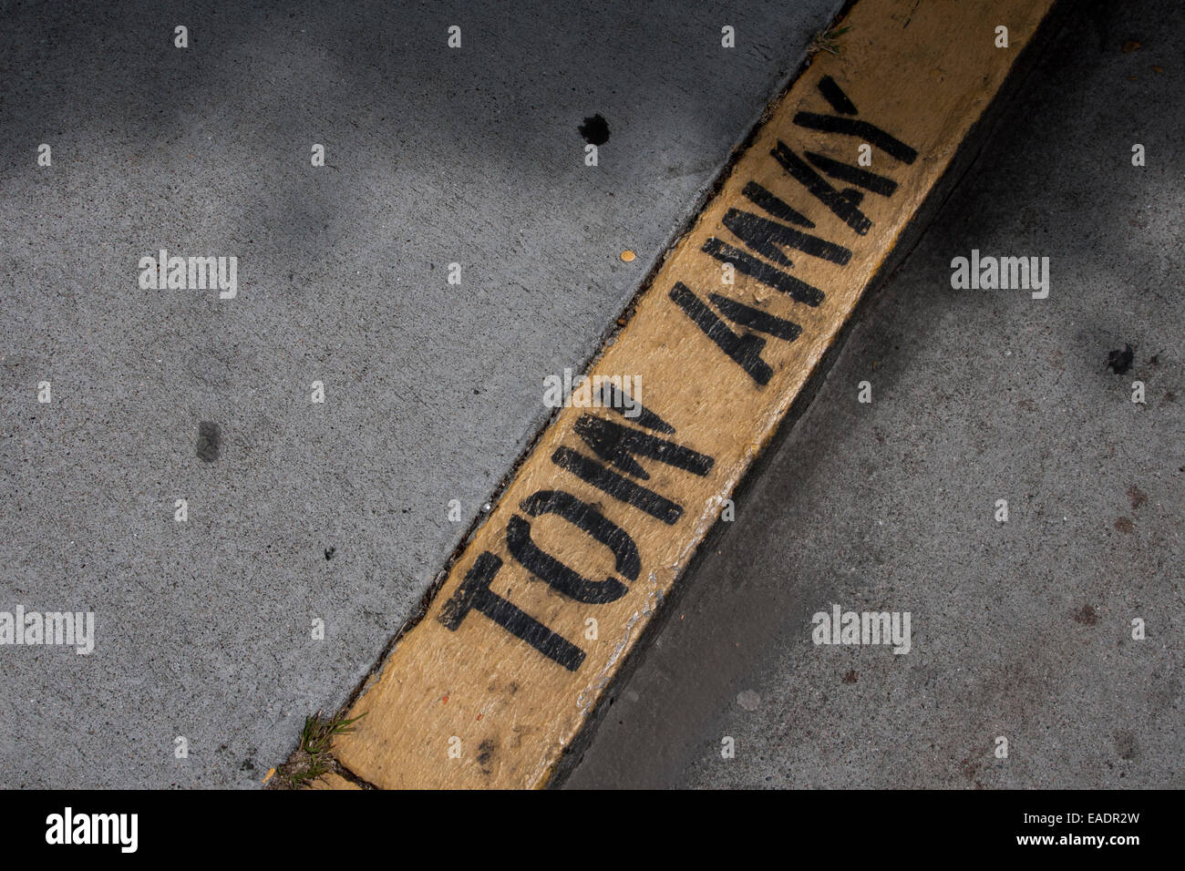 'Tow Away' painted on the curb in San Francisco. Stock Photo