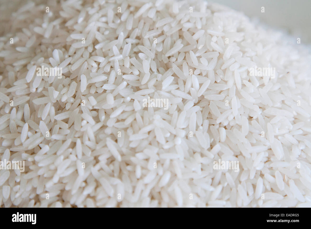 A pile of long grain white rice. Stock Photo