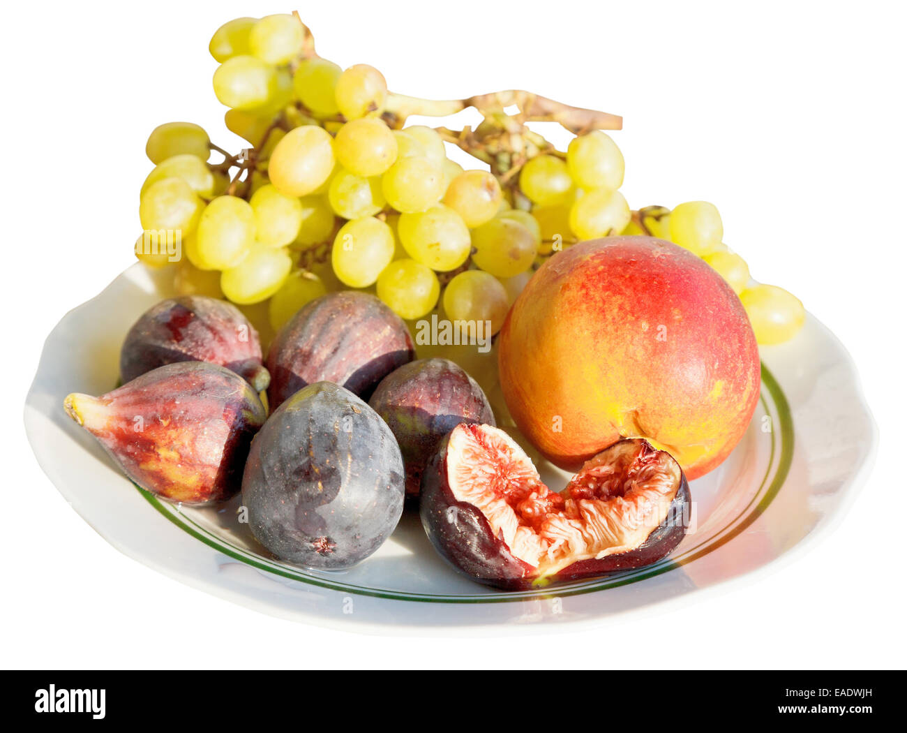 autumn seasonal fruits on plate isolated on white background Stock Photo