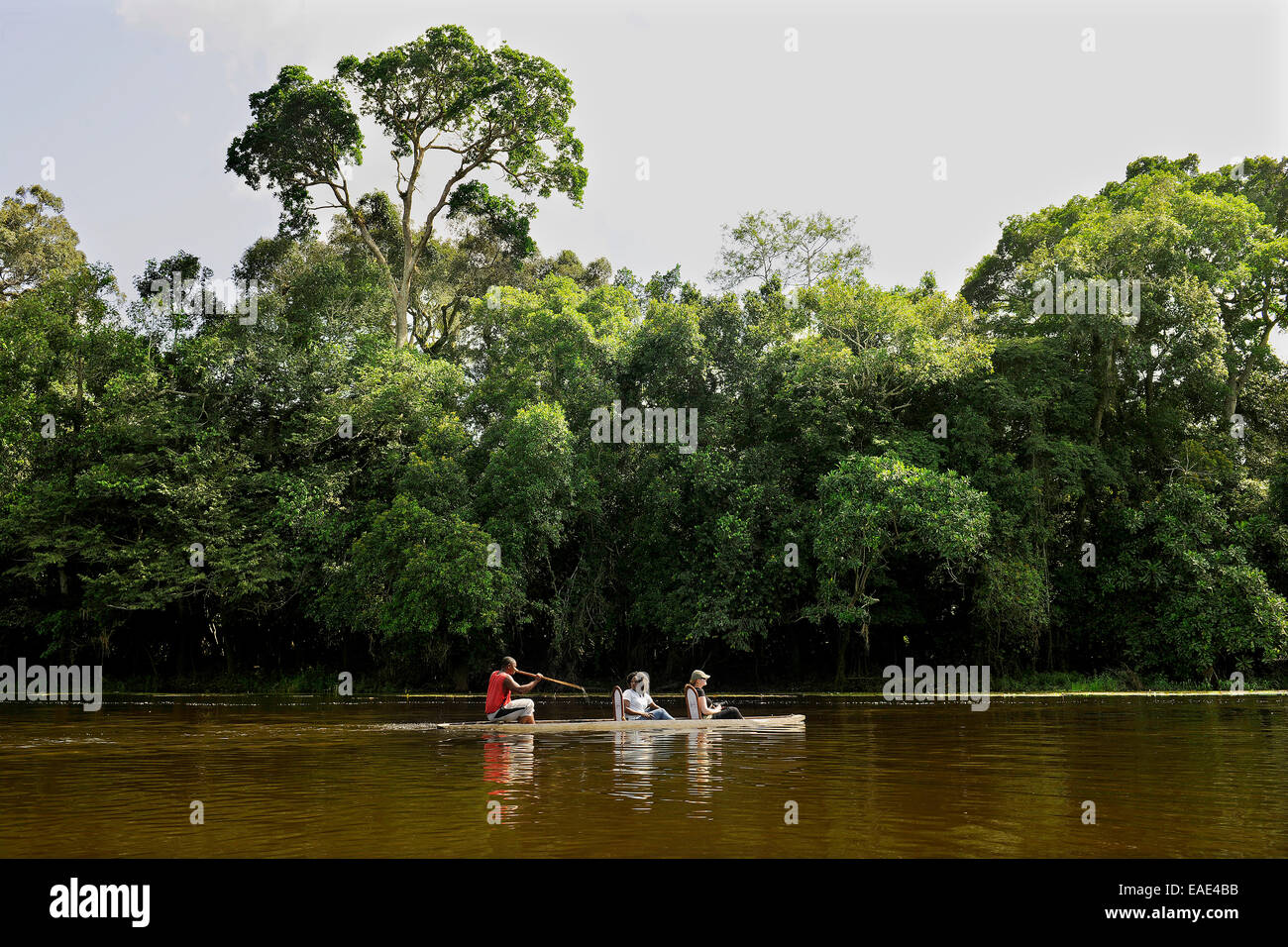 Tourists being rowed across the Nyong River, Centre Region, Cameroon Stock Photo