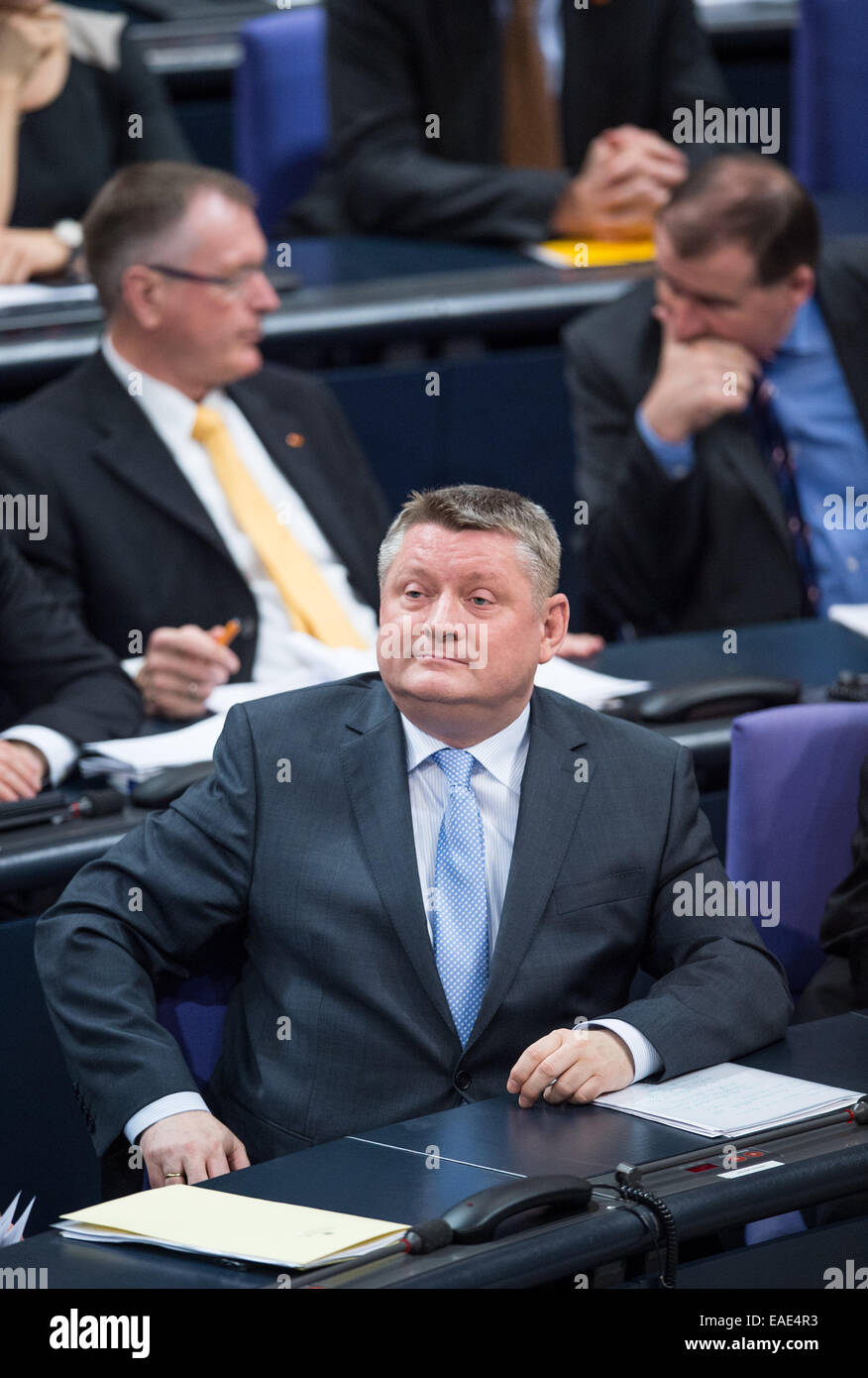 Berlin, Germany. 13th Nov, 2014. German Minister of Health Hermann Groehe (C, CDU) sits in the German Bundestag in Berlin, Germany, 13 November 2014. The first debate is held about end-of-life care and euthanasia, next to a debate on matters of topical interests follows one about 'coal power station and climate target'. Photo: Bernd von Jutrczenka/dpa/Alamy Live News Stock Photo