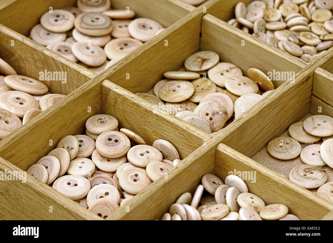 Wooden all alike buttons in wooden box Stock Photo - Alamy