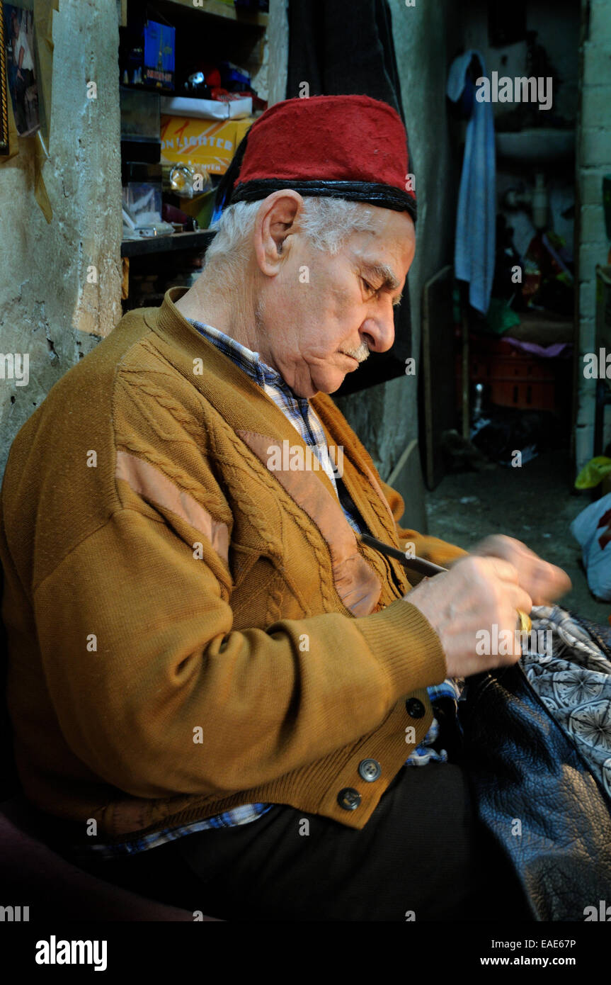Arab craftsman working in the bazaar of Nazareth, Nazareth, Israel Stock Photo