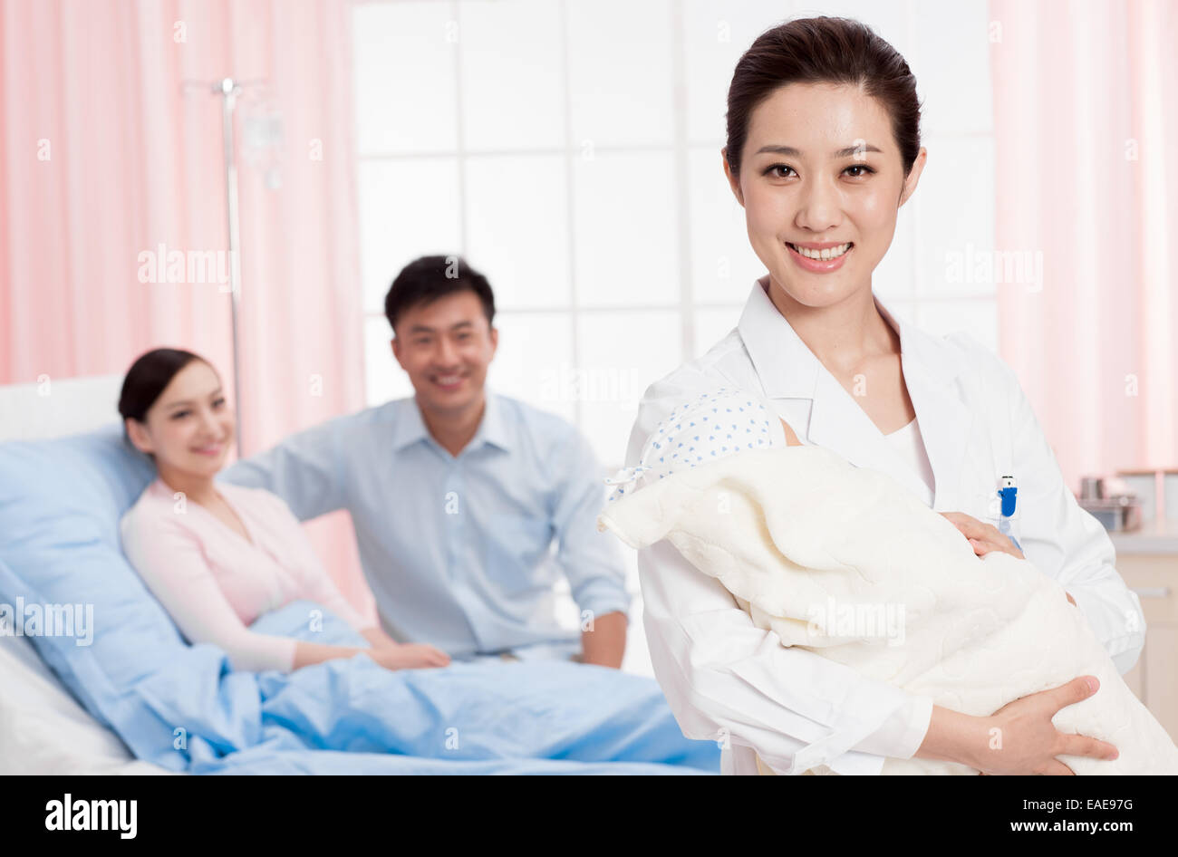 Mother holding baby in hospital hi-res stock photography and images - Alamy