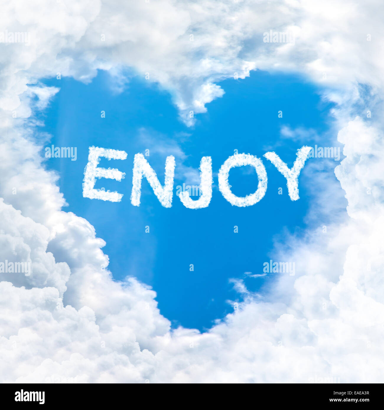 Blue Enjoy love enjoy word on blue sky inside heart cloud form Stock Photo - Alamy