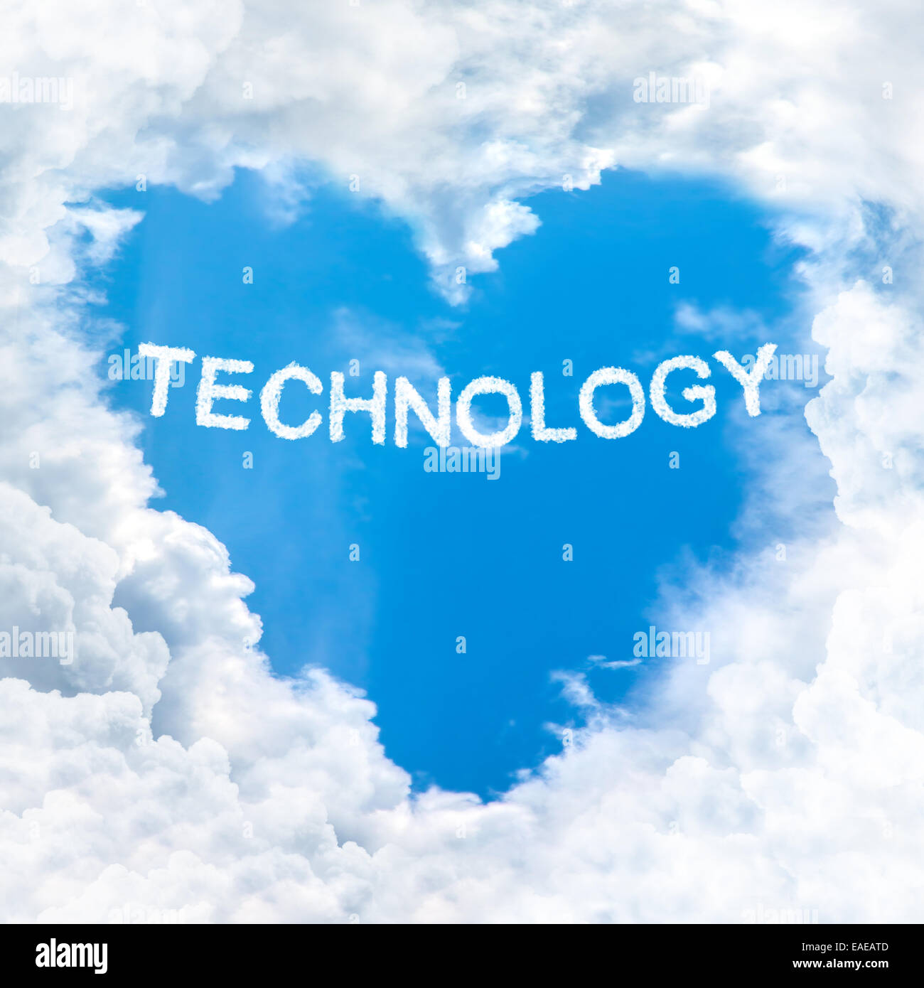technology word nature on blue sky inside love heart cloud form Stock Photo