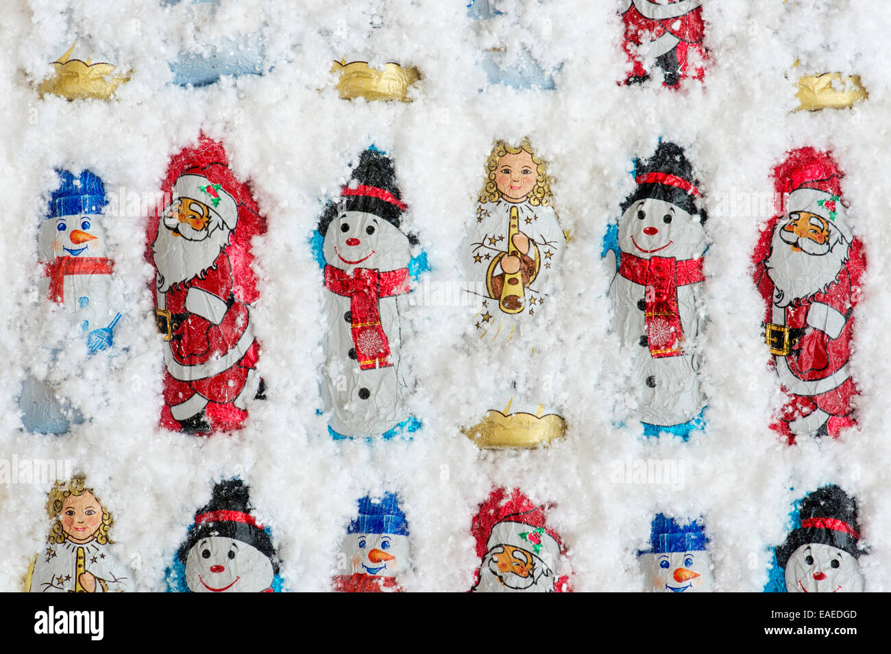 Assorted Christmas tree decoration chocolates in snow Stock Photo