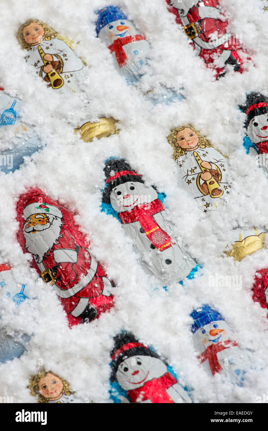 Assorted Christmas tree decoration chocolates in snow Stock Photo