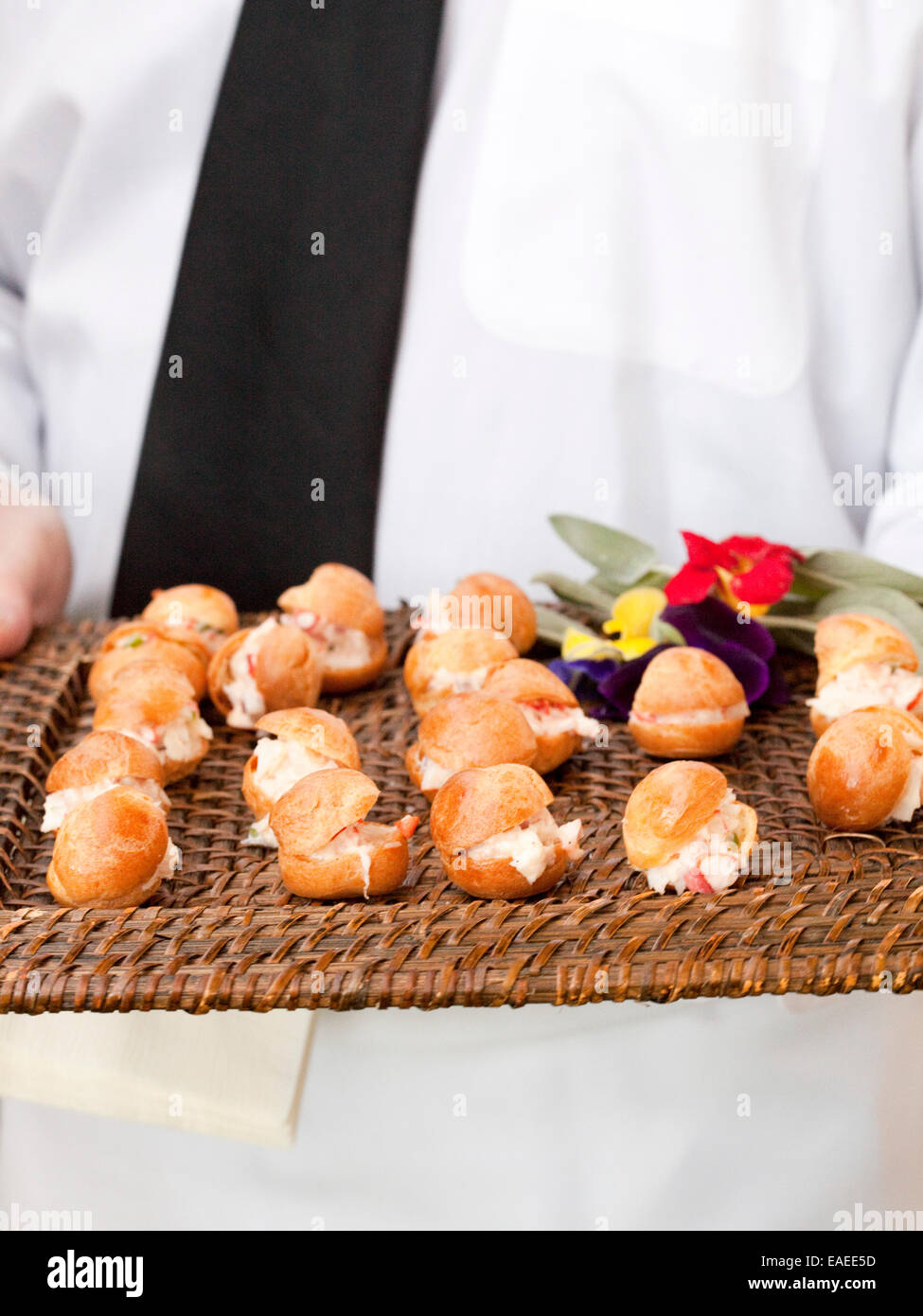 Serving mini lobster roll Hors d'oeuvres on tray at a reception Stock Photo
