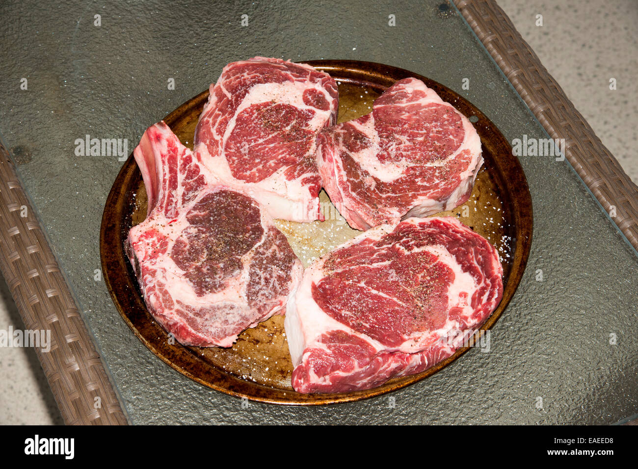 Pre cooked four large spare ribs Stock Photo