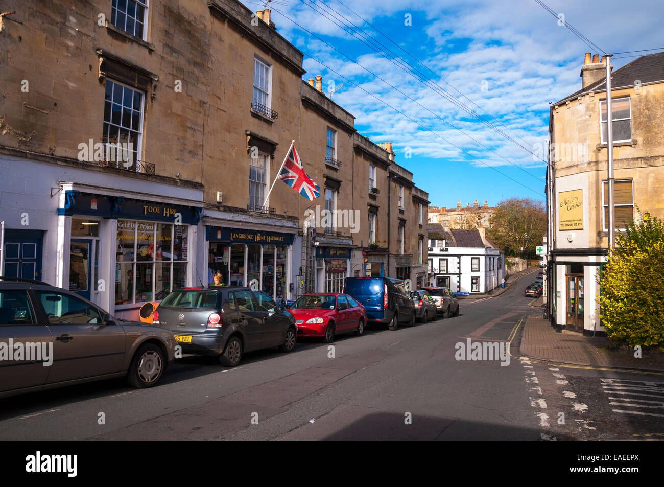 The High Street shops and cars parked in Larkhall Bath Somerset Stock Photo