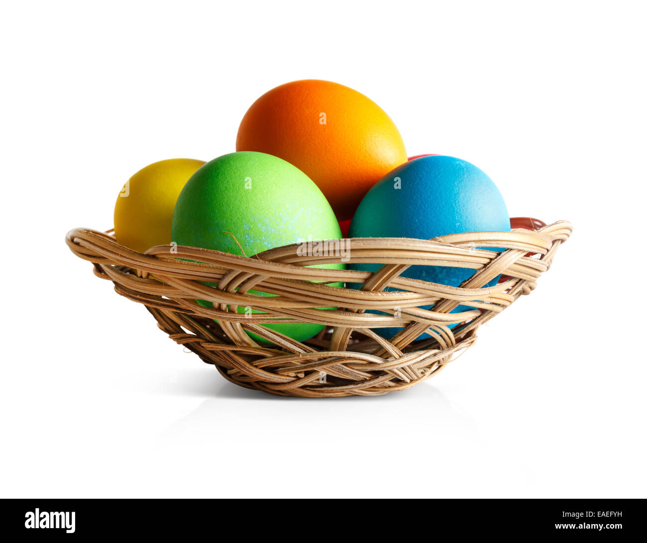 Easter eggs in a wicker basket. White background Stock Photo - Alamy
