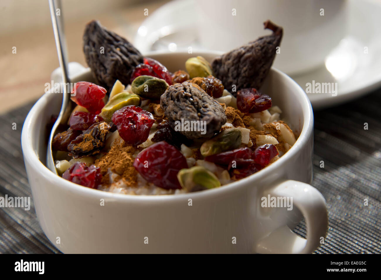 coffee and oatmeal with dried fruit and nuts, espresso Stock Photo Alamy