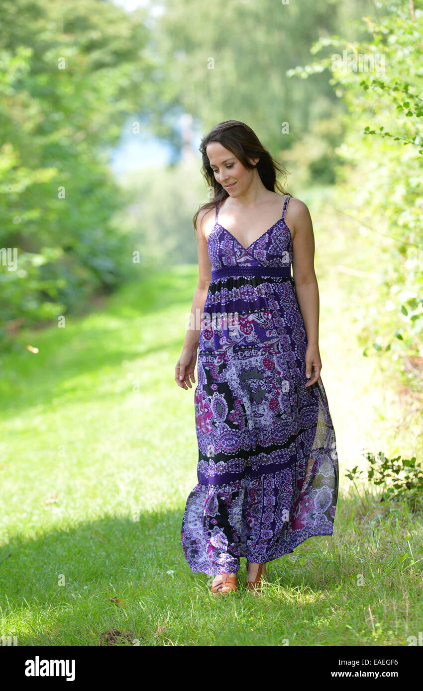 Portrait of a dark haired woman in a summer dress Stock Photo - Alamy