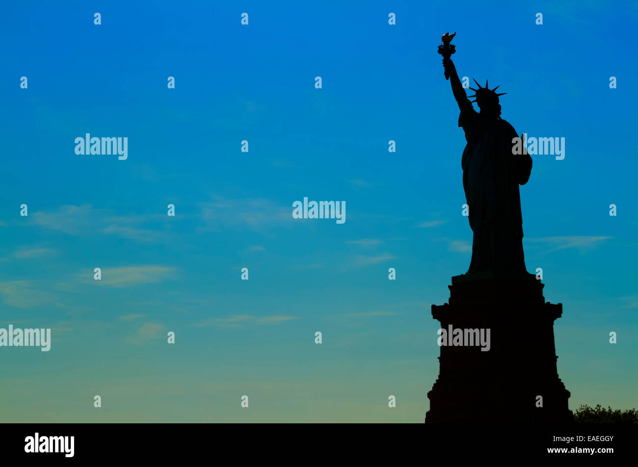 Views of New York City, USA. Staue of Liberty silhouette at sunset ...