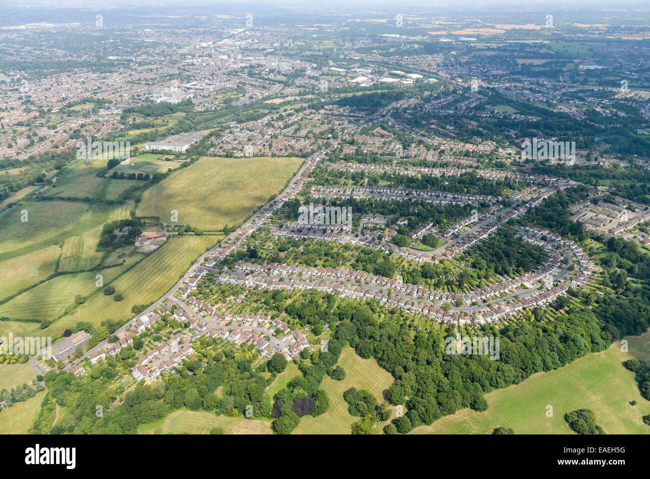 An aerial view showing suburban housing south of Watford with the town visible in the background. Stock Photo