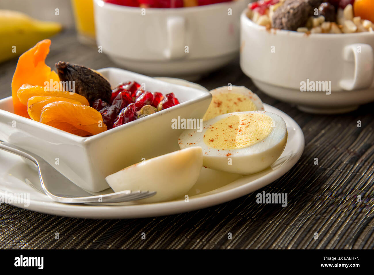 Fresh fruit and oatmeal with nuts and fruit toppings for breakfast Stock Photo