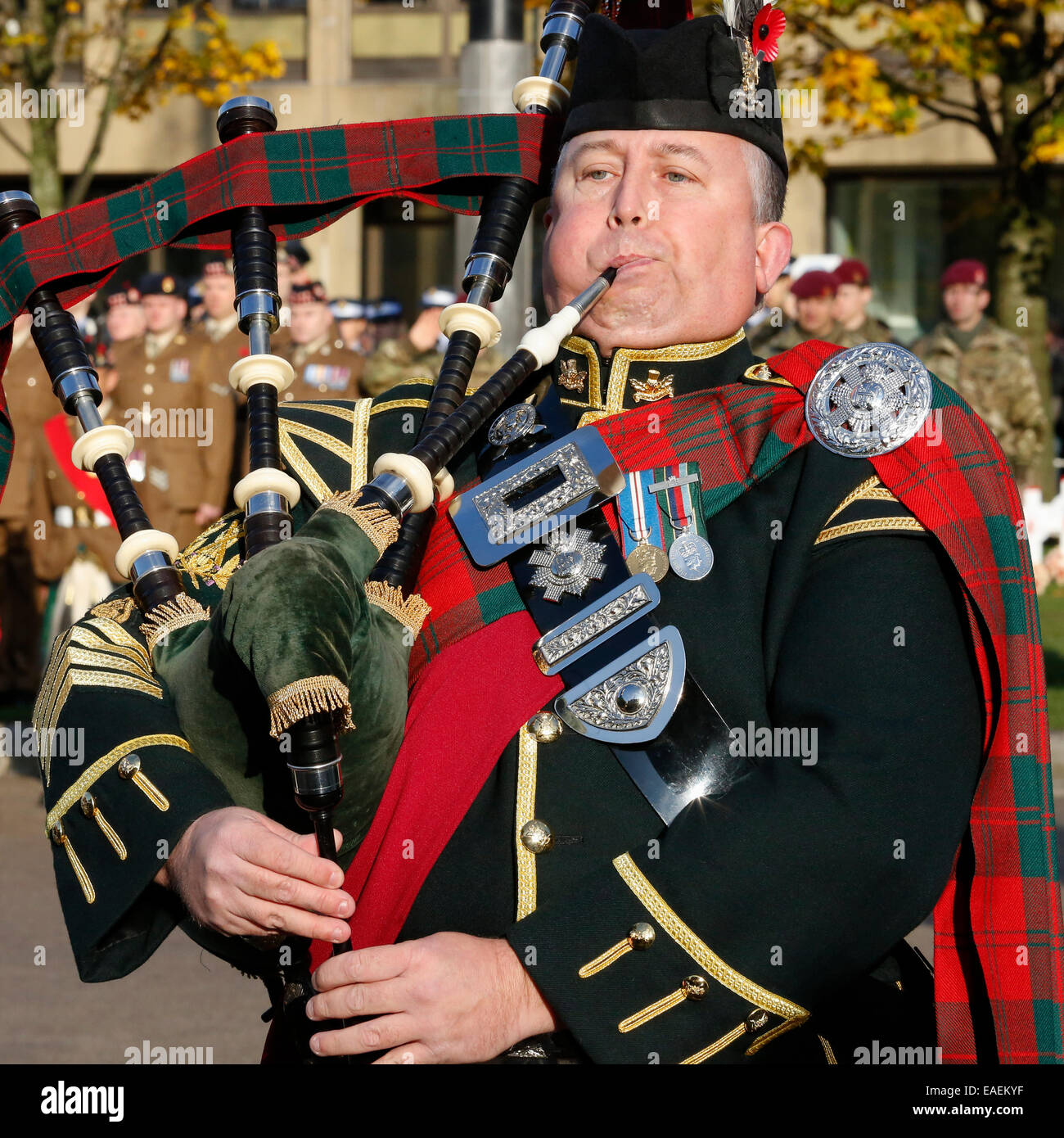 Military piper playing at a army parade, Glasgow, Scotland, UK Stock Photo