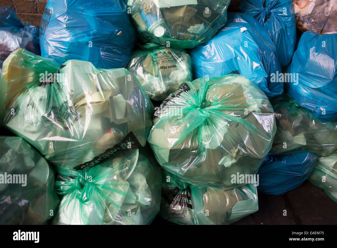 Refuse bags full of materials for recycling in different coloured