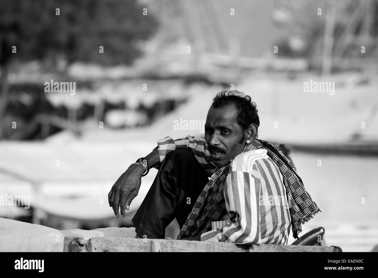 male, Indian, sitting, wearing shirt, paint, villager in Pushkar, Rajasthan, India. Stock Photo