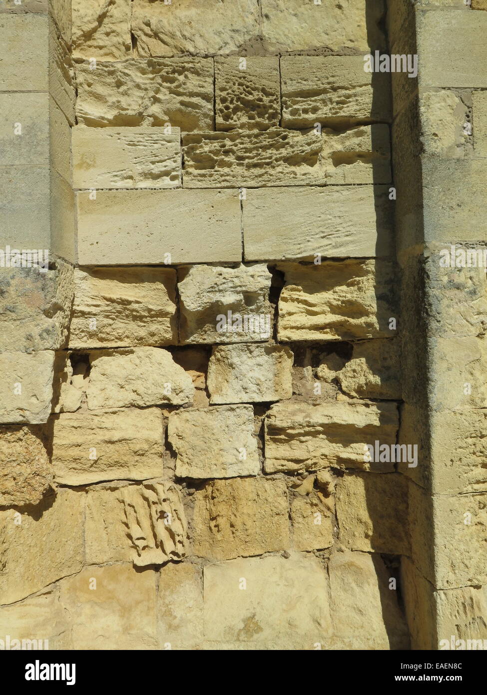 Ancient Limestone wall with weathering and pollution effect Stock Photo