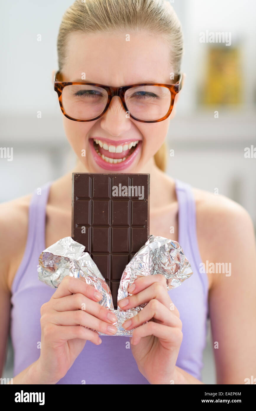 Portrait of happy young woman with chocolate Stock Photo