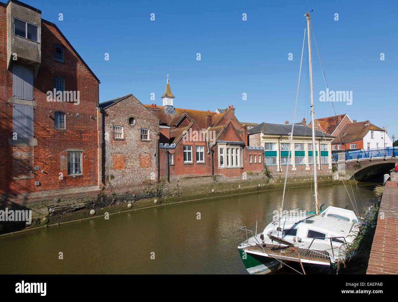 Waterfront warehouse and commercial buildings on the River Ouse in Lewes, East Sussex, UK Stock Photo