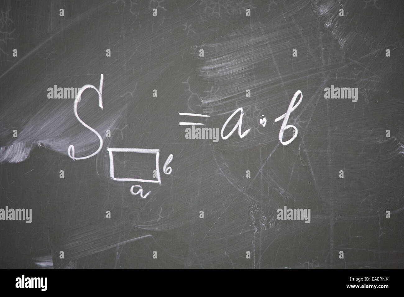formula of rectangle area written on school blackboard closeup Stock Photo
