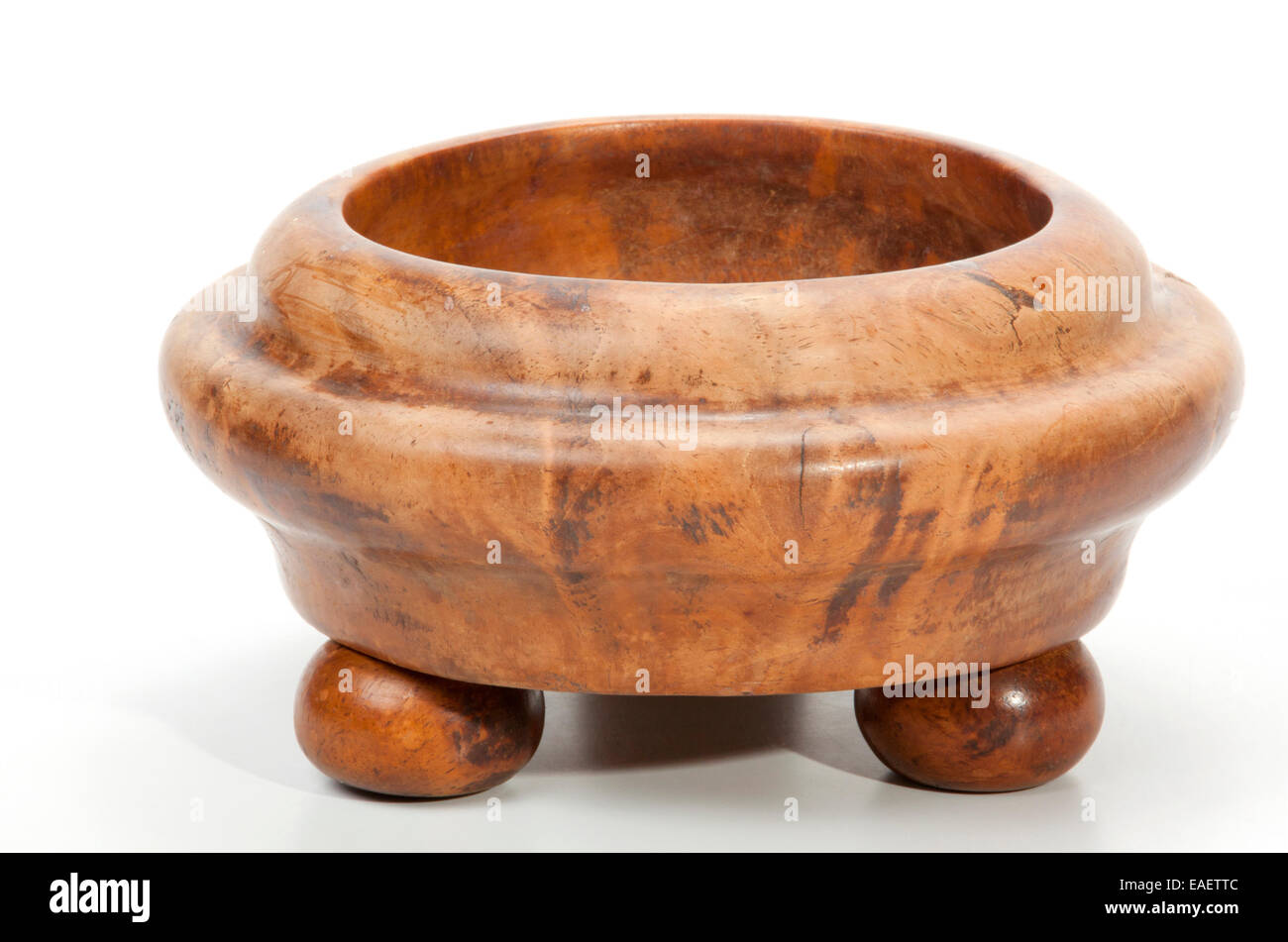 turned wooden decorative bowl with ballshaped legs Stock Photo Alamy
