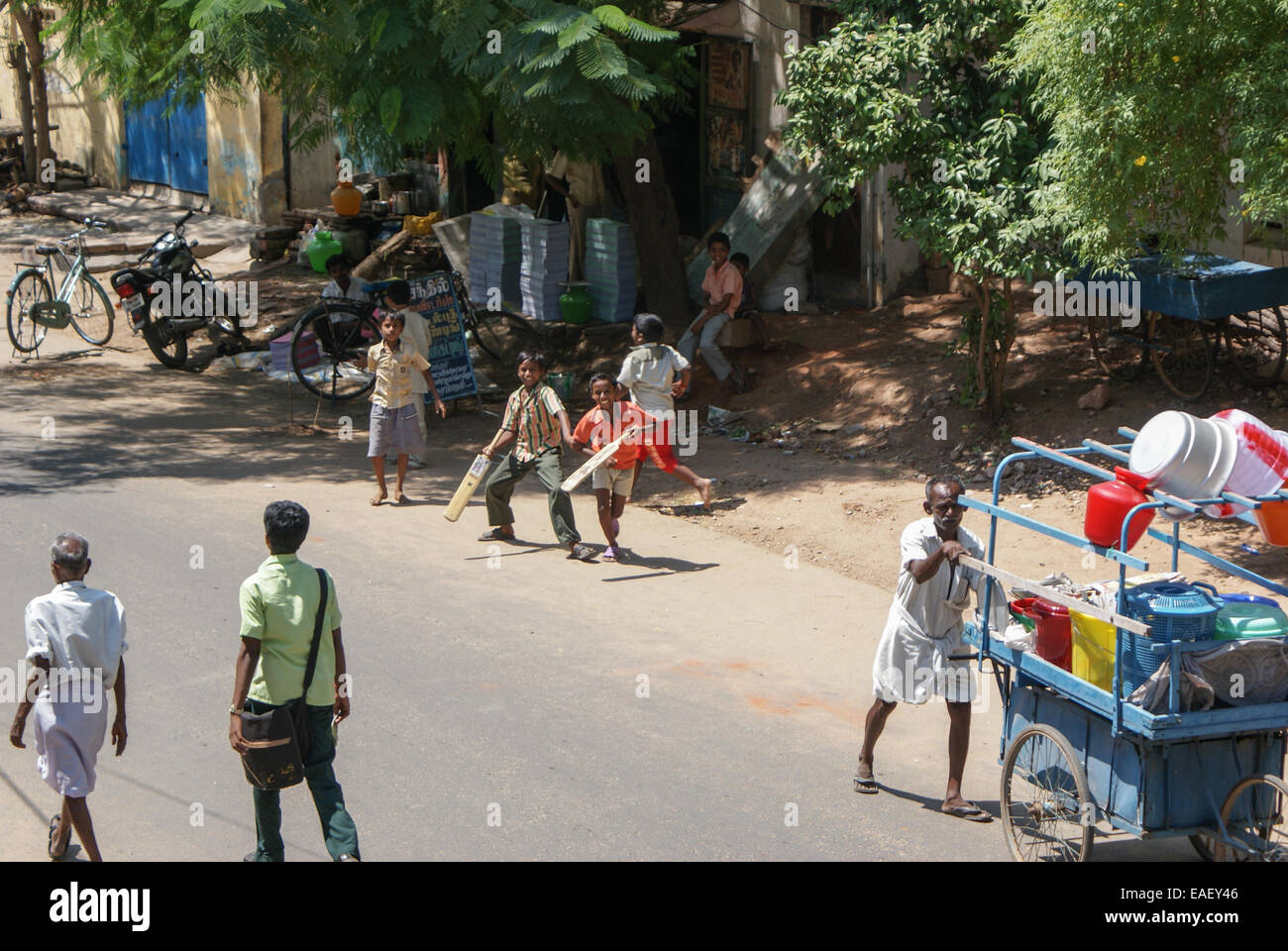 Madurai, India - May 10, 2008. Boys play cricket in the street in Madurai Stock Photo