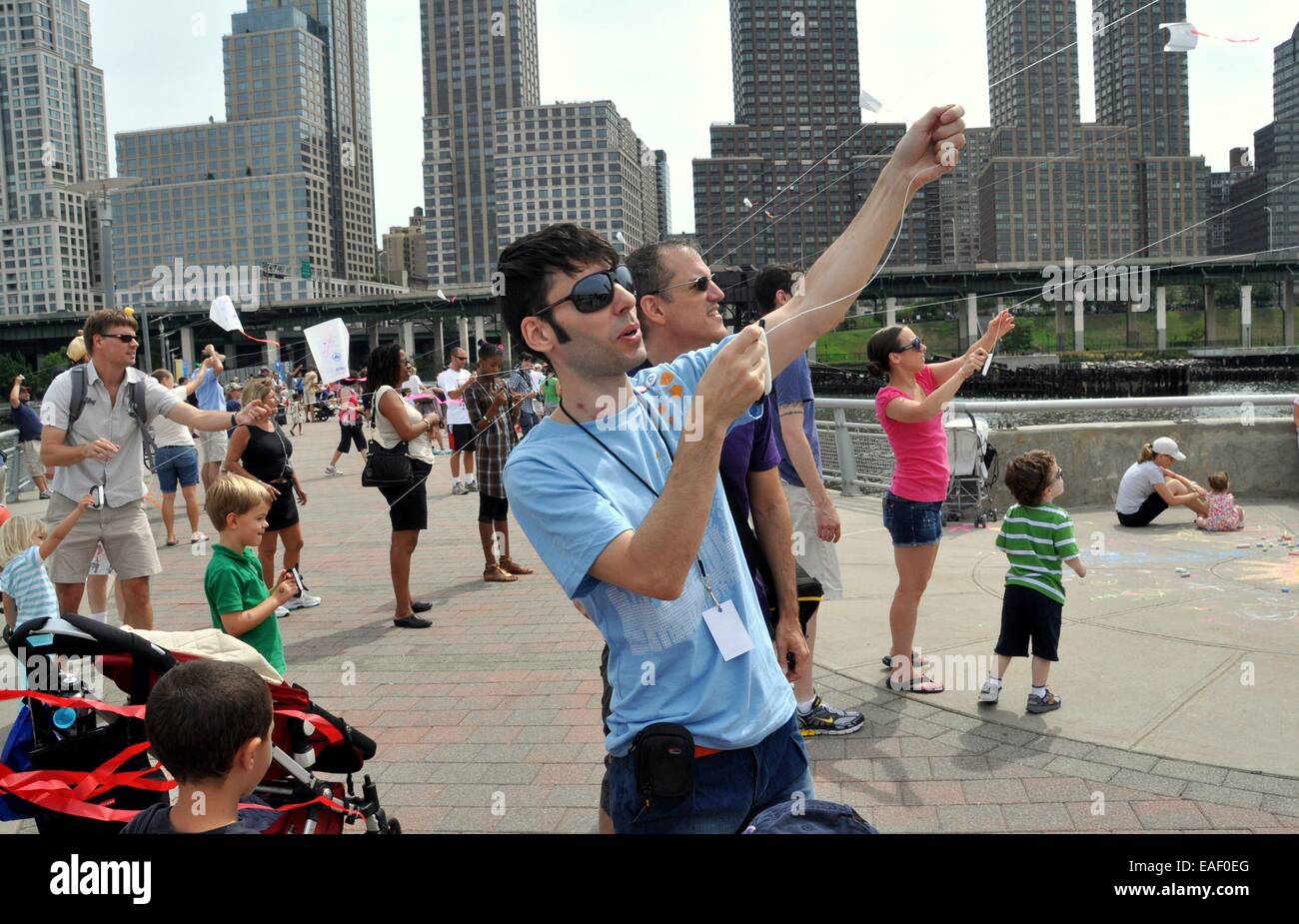 NYC New Yorkers flying kites on Hudson River Pier 70 during the second annual FlyNY Kite