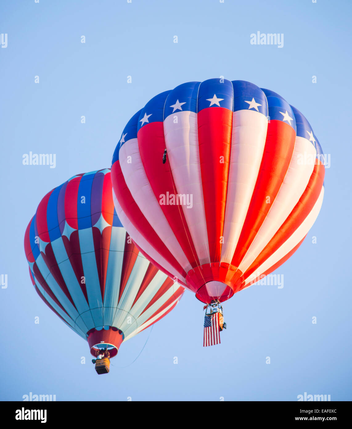 Hot Air Balloons lifting off in blue sky.Spirit of Boise balloon