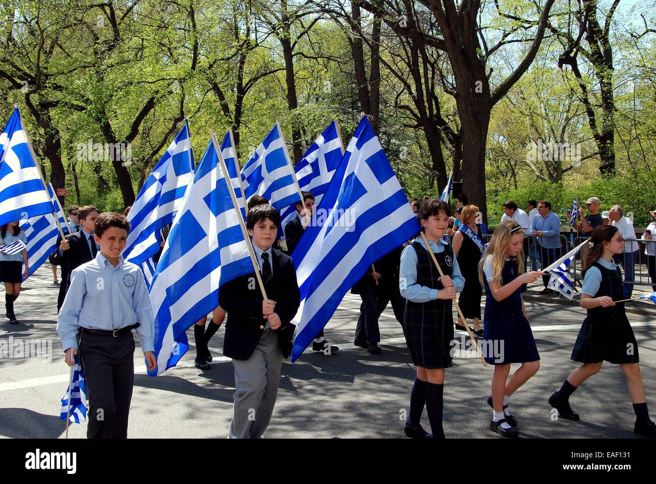 NYC:  Children carrying Greek flags marching in the Greek Independence Day Parade on Fifth Avenue Stock Photo