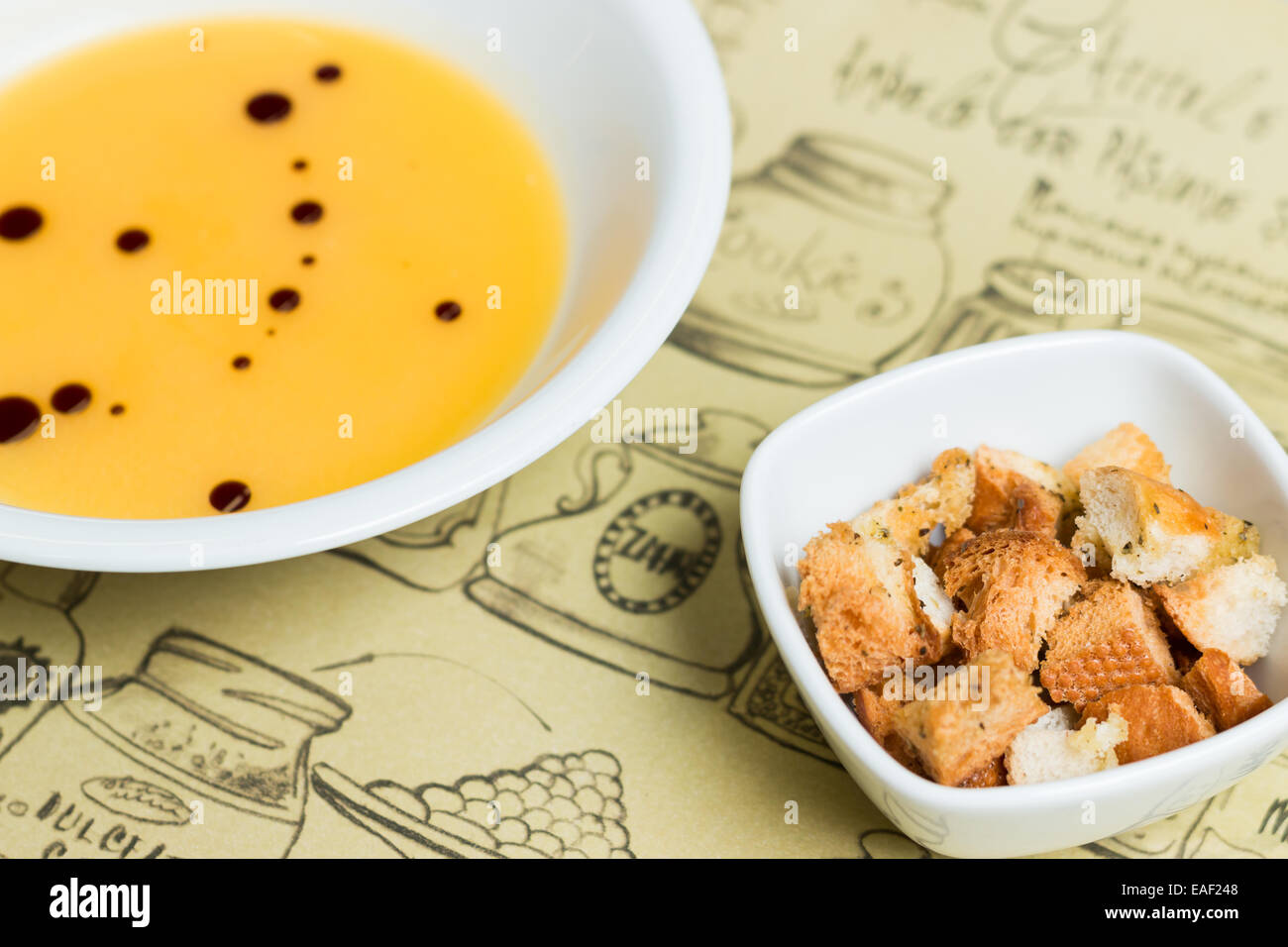 Pumpkin cream soup with croutons Stock Photo