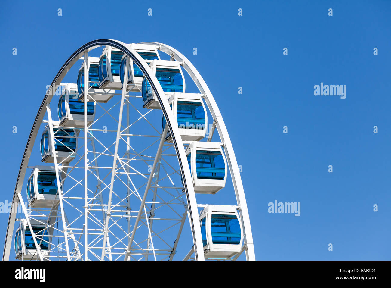 Ferris wheel over clear blue sky background Stock Photo