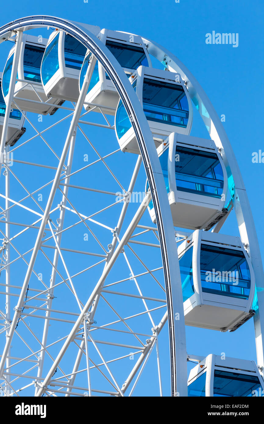 Ferris wheel over clear blue sky background, vertical photo Stock Photo