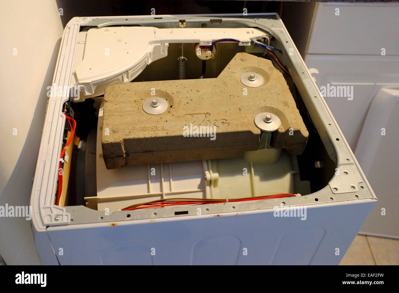 washing machine internal stabilizing concrete weight Stock Photo Alamy