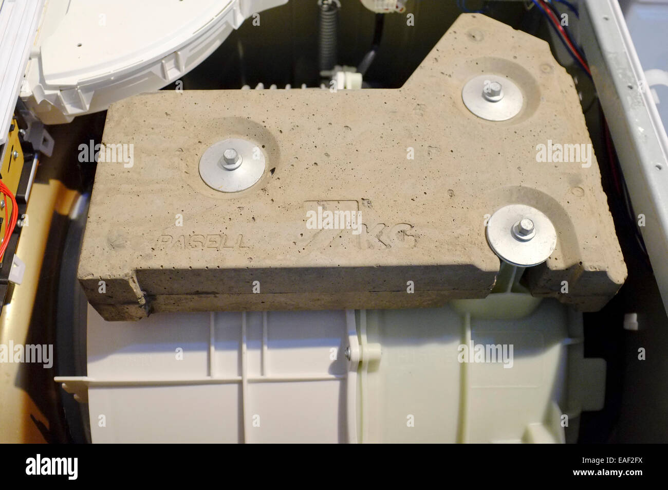 washing machine internal stabilizing concrete weight Stock Photo - Alamy