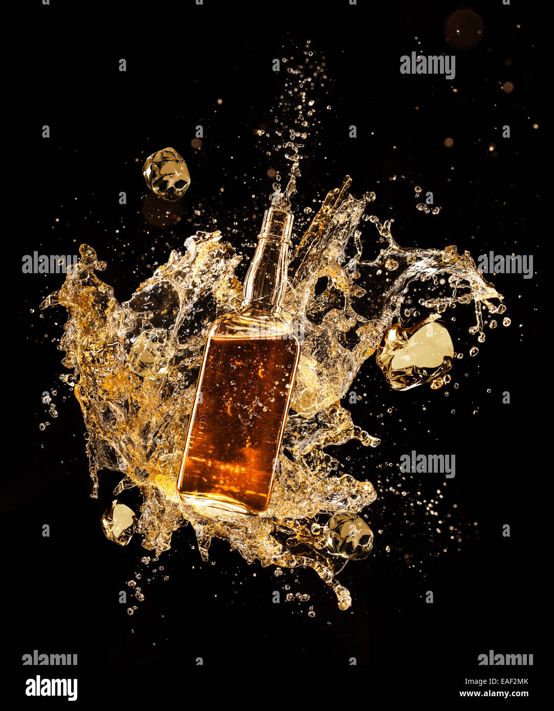 Concept of liquor splashing around bottle, isolated on black background ...