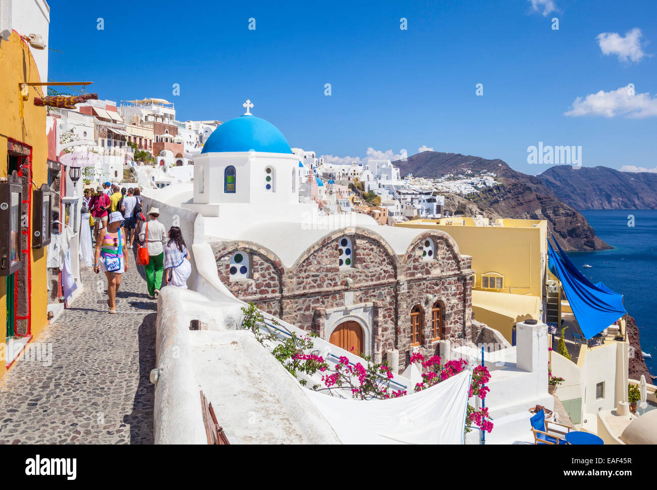 Greek church of Saint Nicholas and tourists, Oia, Santorini, Thira, Cyclades Islands, Greek Islands, Greece, EU, Europe Stock Photo
