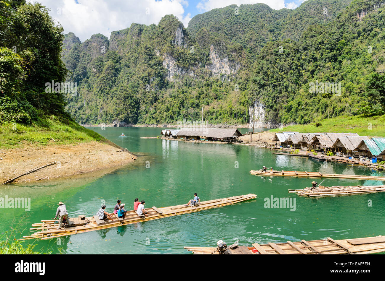SURAT THANI, THAILAND - APR 26, 2013 : The arrival of tourists to go visit the stalactite cave by motor raft in Ratchaprapha Dam Stock Photo