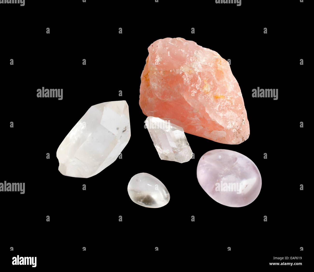 Semiprecious silica rocks, clear quartz, rose quartz and amethyst, isolated on black Stock Photo