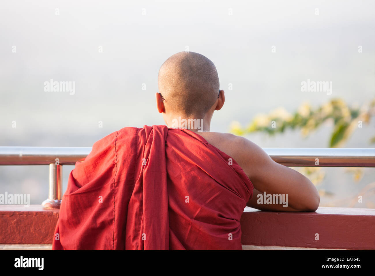 Buddhist monk observing the view from on top of Mandalay Hill,Mandalay,Burma,Myanmar,Asia. Stock Photo