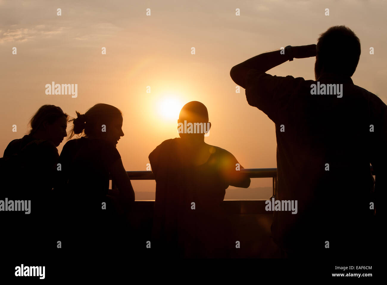 Tourists and Buddhist monks watching view at sunset from Mandalay Hill, Mandalay, Myanmar,Burma,South East Asia, Asia, Stock Photo