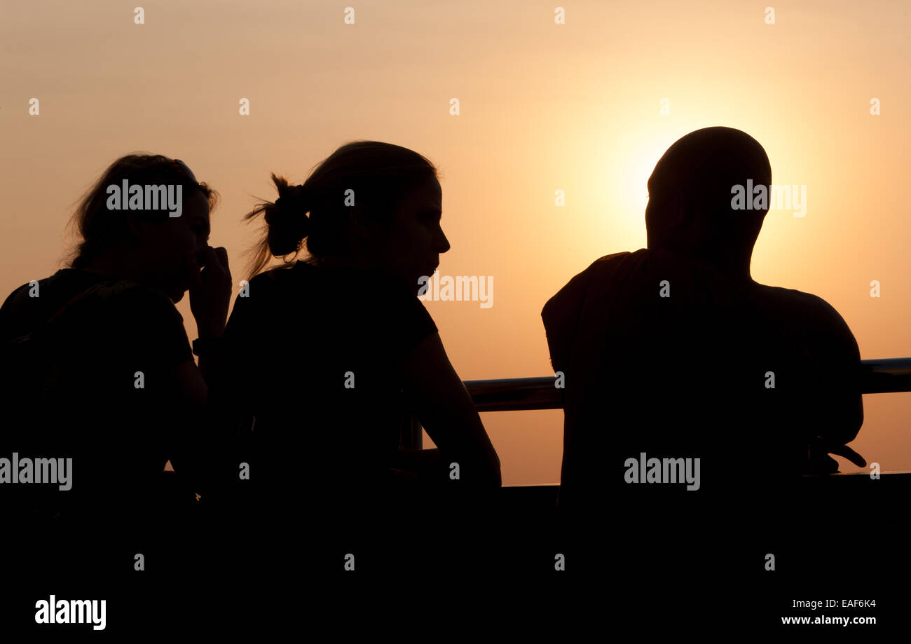 Tourists and Buddhist monks watching view at sunset from Mandalay Hill, Mandalay, Myanmar,Burma,South East Asia, Asia, Stock Photo