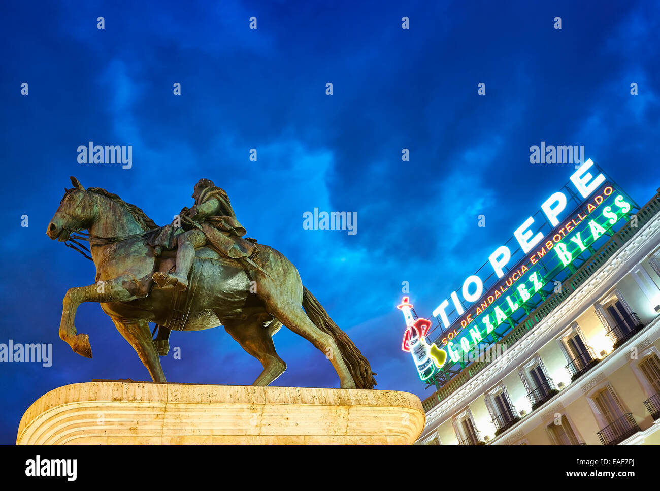 Carlos III statue and TIo Pepe luminous sign at  Puerta de Sol square. Madrid, Spain Stock Photo