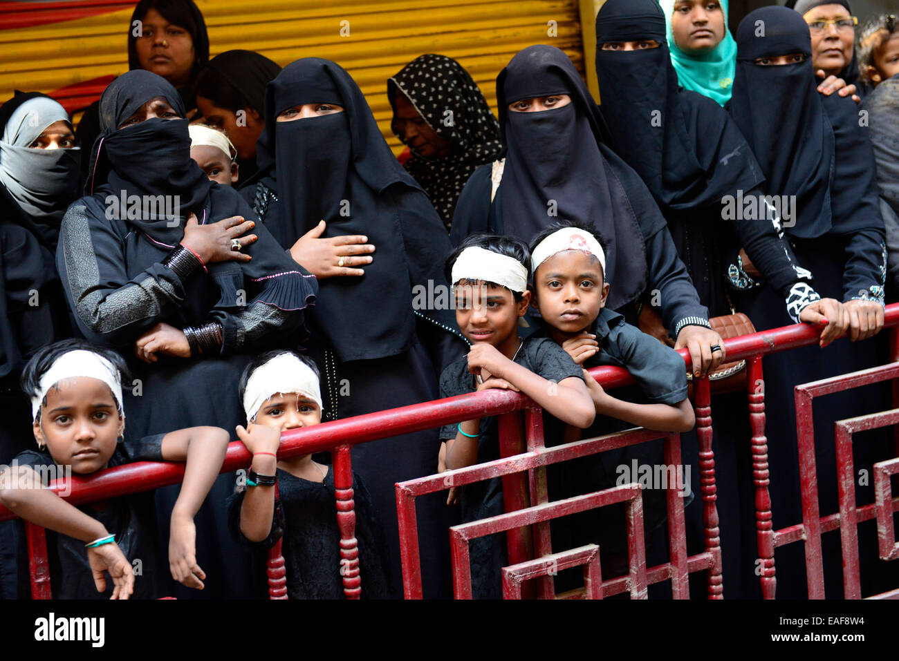 Women and children observing the Ashura day procession. Stock Photo