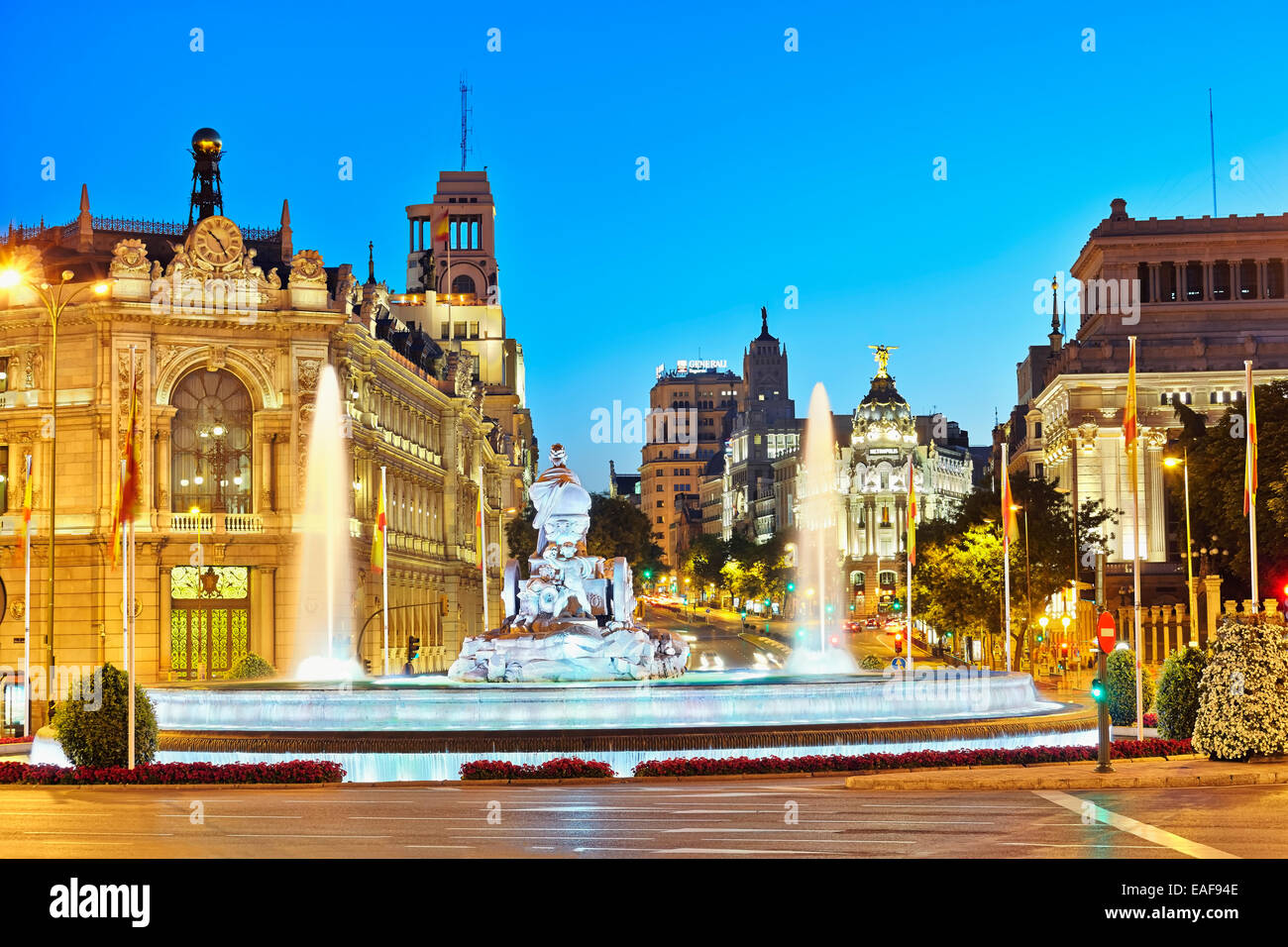 Plaza de Cibeles square with the Bank of Spain at the left, a rear view of Cibeles fountain, the Metropolis building and Gran Vi Stock Photo