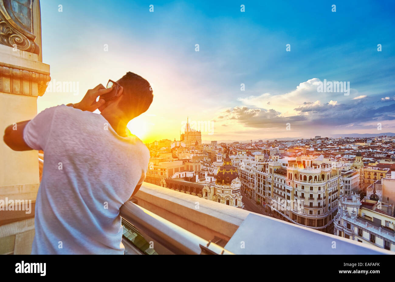 Man on the phone at The Circulo de Bellas artes cultural center rooftop terrace. Madrid. Spain Stock Photo
